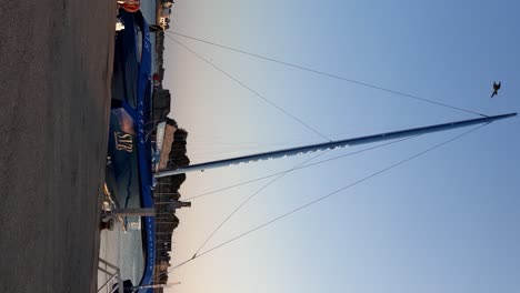 View-of-blue-Trimaran-of-famous-french-offshore-sailer-yacht-racer-François-Gabart-at-harbour-of-concarneau-in-France