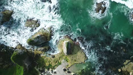 Ocean-Waves-and-Cliffs:-Aerial-View-from-Ireland-Watch-as-slow-waves-gently-collide-with-rocky-cliffs-in-this-mesmerizing-drone-footage,-capturing-the-serene-beauty-of-coastal-landscapes