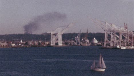 16mm-Color-Film-of-Seattle's-Shipping-yard-with-a-sail-boat-in-the-foreground