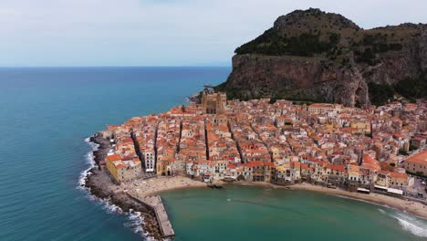 Drone-Orbits-Above-Coastal-Beach-Town-of-Cefalu-in-northern-Sicily