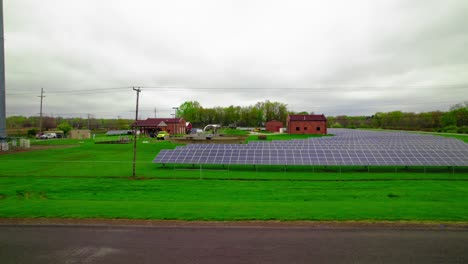 Solar-panel-installation-in-Rittman,-Ohio,-showcasing-a-green-energy-project-amidst-rural-settings-to-promote-sustainable-energy-solutions