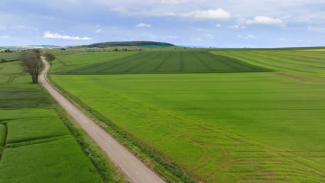 Aerial-view-of-road-and-fields,-French-landscape,-North-of-France