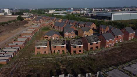 Residential-housing-framework-aerial-view-rising-back-from-unfinished-rooftop-development-on-urban-building-site-real-estate