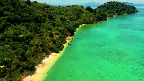 4K-Cinematic-nature-drone-footage-of-a-panoramic-aerial-view-of-the-beautiful-beaches-and-islands-surrounding-the-island-of-Koh-Lanta-in-Krabi,-South-Thailand,-on-a-sunny-day