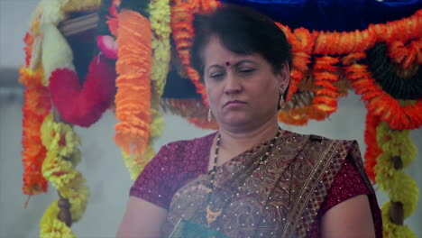 Contemplative-Hindu-woman-at-Ganesh-festival