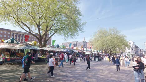 Busy-People-shopping-and-commuting-in-Norwich-city-market-square