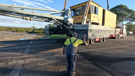 reversing-a-large-dredging-barge-down-a-boat-ramp-on-a-semi-trailer