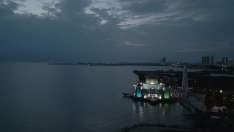 Rainbow-Mosque-At-Waters-Edge-In-Melaka-Malaysia