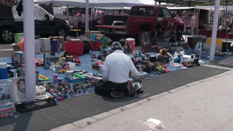 Flea-market-man-setting-up-his-space