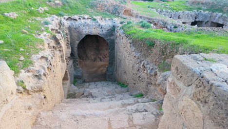 An-ancient-stone-tomb-entrance-at-the-Tombs-of-the-Kings-in-Pafos,-Cyprus