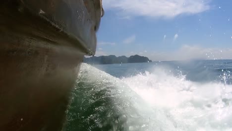 Wooden-Boat-Run-Through-Sea-Wave,-Close-Up