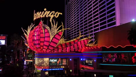 Flamingo-Las-Vegas-Hotel-Casino-Exterior-at-NIght,-Iconic-Logo-in-Neon-Lights,-Nevada-USA