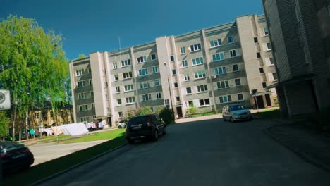 Meandering-and-floating-through-an-Eastern-European-suburb-with-apartments-swinging-moving-forward-with-Dutch-Angle-and-forward-movement