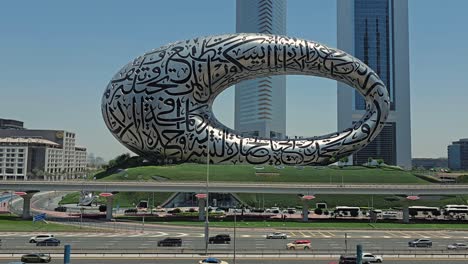 A-stunning-view-of-Dubai's-Museum-of-the-Future,-along-with-Sheikh-Zayed-Road-and-city-traffic