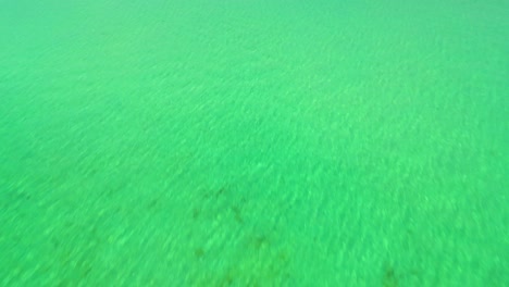 4K-Cinematic-nature-drone-footage-of-a-panoramic-aerial-view-of-the-beautiful-beaches-and-islands-surrounding-the-island-of-Koh-Lanta-in-Krabi,-South-Thailand,-on-a-sunny-day