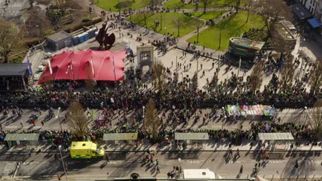 Bird's-eye-view-above-Eyre-square-buzzing-with-festive-life-during-parade,-Galway-Ireland