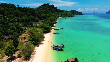 4K-Cinematic-nature-drone-footage-of-a-panoramic-aerial-view-of-the-beautiful-beaches-and-islands-surrounding-the-island-of-Koh-Lanta-in-Krabi,-South-Thailand,-on-a-sunny-day