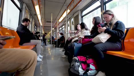 Ankara,-Türkiye:-Perspective-of-the-interior-of-a-metro-carriage,-highlighting-the-modern-design-and-daily-commuters