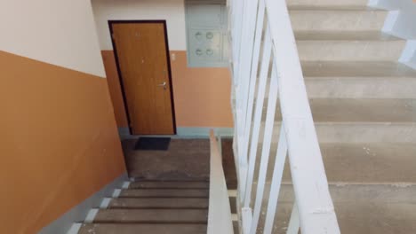 Interior-of-vintage-soviet-apartment-buidling-with-stair-and-wooden-metal-doors