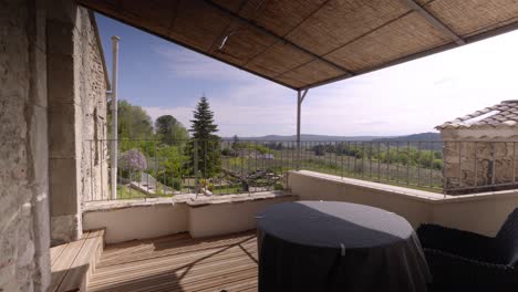 Slow-motion-establishing-shot-of-a-villa-balcony-lookout-out-over-Tresques