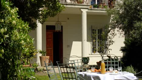Slow-establishing-shot-of-a-villa-with-breakfast-on-the-table-outside