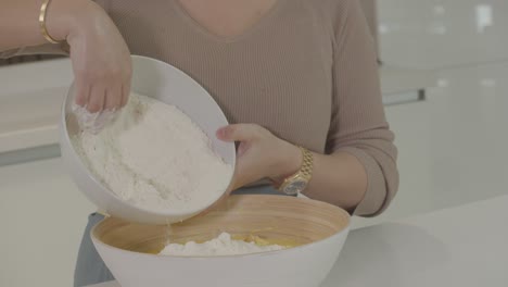 Pour-the-wheat-flour-into-a-bowl-to-make-bread-dough