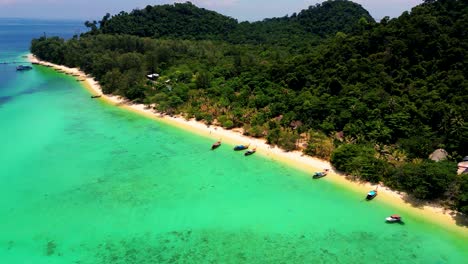 4K-Cinematic-nature-drone-footage-of-a-panoramic-aerial-view-of-the-beautiful-beaches-and-islands-surrounding-the-island-of-Koh-Lanta-in-Krabi,-South-Thailand,-on-a-sunny-day