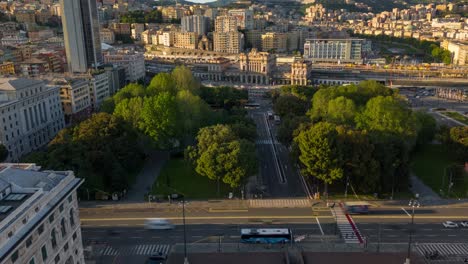 Aerial-timelapse-of-Genoa-city-center-at-dusk-showcasing-bustling-traffic-and-vibrant-green-parks