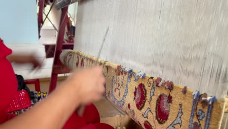 Albanian-woman-at-weaving-workshop-producing-traditional-carpet