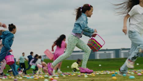 Children-eagerly-run-with-baskets-to-collect-colorful-eggs-at-an-egg-hunting-event,-showcasing-their-excitement-and-joy