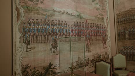 Historic-military-wall-painting-in-Trakošćan-Castle,-Croatia,-depicting-soldiers-in-formation