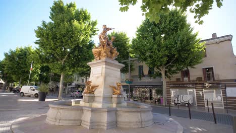 Slow-motion-revealing-shot-of-the-Golden-Angel-fountain-in-Carpentras