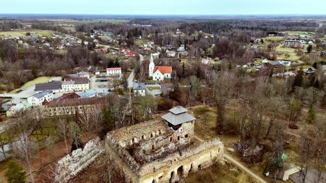 Rauna-Parish-Ruins,-Latvia-Travel-historic-destination-aerial-town-panoramic-sky