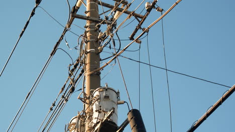 Electrical-net-of-poles-against-the-blue-sky