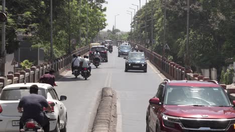 There-are-many-bikes-cars-coming-over-the-bridge-and-many-bikes-and-going-to-work