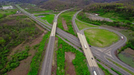 Semi-Trucks-Navigating-Highway-Ramp-in-Pennsylvania,-United-States