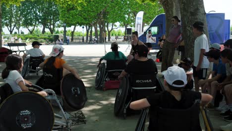 Establishing-shot-of-children-trying-out-wheelchair-ball-sports-on-a-trip