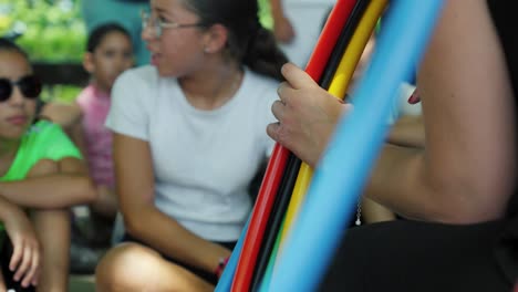 Slow-motion-shot-of-kids-excited-to-play-with-hula-hoops-at-a-sports-day