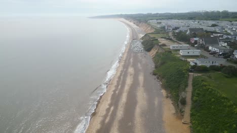 Forward-drone-view-of-historic-Pakefield-Beach-during-evening-in-Lowestoft,-England