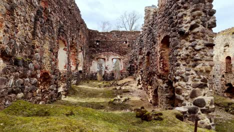 Inside-Ruana-castle-ruins,-European-heritage-fortress,-revealing-slow-shot-drone