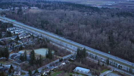 Aerial-View-of-Traffic-on-a-Four-Lane-Highway-at-Dusk