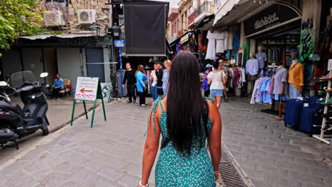 Slow-motion-shot-of-locals-and-tourists-walking-along-Monastiraki-Square-city-center-in-Athens,-Greece-at-daytime