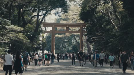 Meiji-Shrine---Tourists-At-The-Entrance-Of-Meiji-Jingu-With-Torii-In-Shibuya,-Tokyo,-Japan