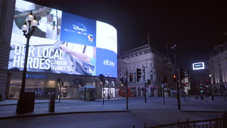 Empty-Picadilly-Circus-in-London-at-night,-during-Coronavirus-lockdown,-view-from-the-underground-station-entrance