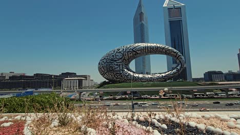 A-stunning-view-of-Dubai's-Museum-of-the-Future,-along-with-Sheikh-Zayed-Road-and-city-traffic