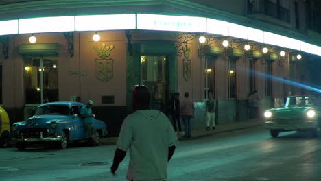 People-cross-the-screen-outside-Floridita-Club-in-Havana-Cuba-at-night