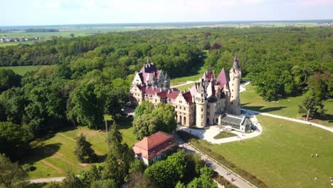 Historic-Castle-In-Moszna-Near-Opole,-Silesia,-Poland---Aerial-Drone-Shot