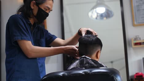 Children's-haircut-in-the-salon-at-the-time-of-the-coronavirus-epidemic