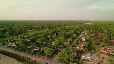 Aerial-view-of-Arlington-Heights,-Illinois,-highlighting-lush-green-neighborhoods-and-main-roads