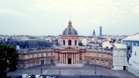 Aerial-view-of-historic-semi-circle-building-with-central-dome,-home-of-French-academy